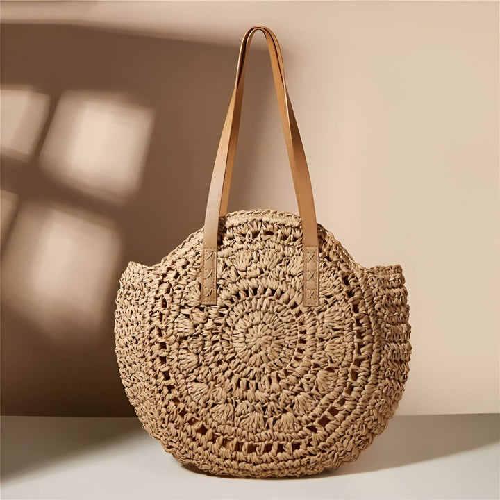 Sac cabas rond tressé en paille beige avec poignées en cuir marron clair., 46194029756640,46194029789408