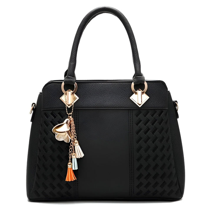 Sac à main noir avec texture tissée, poignées, détails dorés et charm floral avec pompons colorés., 46193874075872,46193874108640,46193874141408,46193874174176,46193874206944,46193874239712