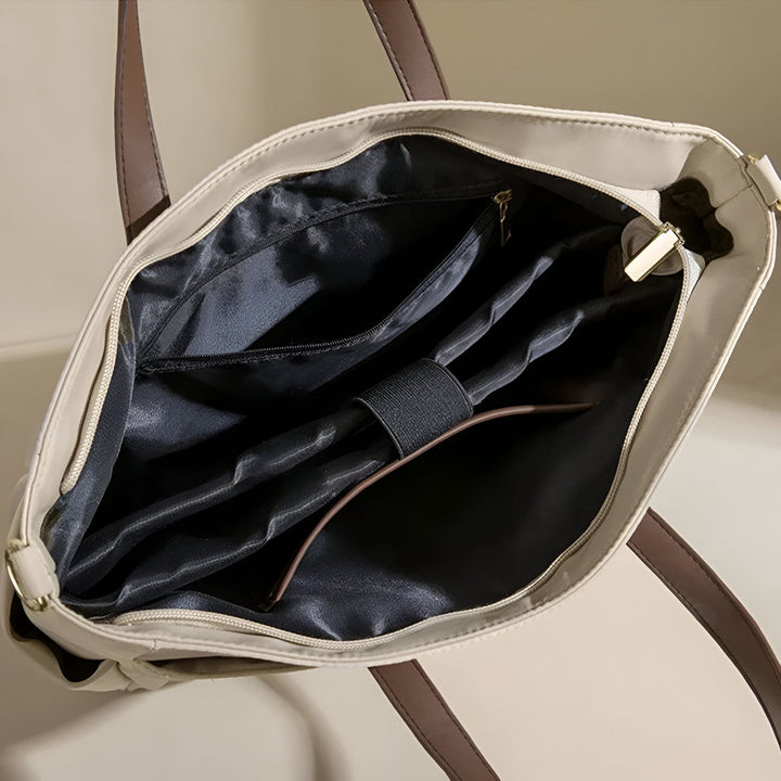 Sac cabas beige ouvert, intérieur noir avec poches, compartiments de rangement et élastique de maintien., 46193952915680,46193952948448,46193952981216,46193953013984