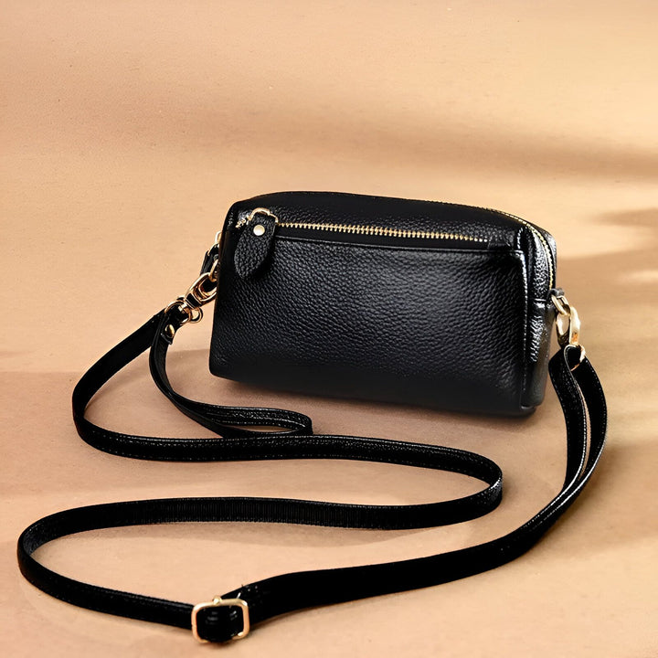 Sac bandoulière noir en cuir avec fermeture éclair dorée., 46266441924832,46266441957600,46266441990368