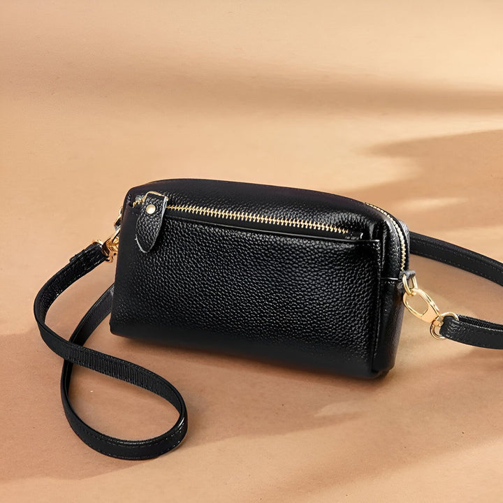Sac bandoulière noir en cuir grainé avec zip doré., 46266441924832,46266441957600,46266441990368