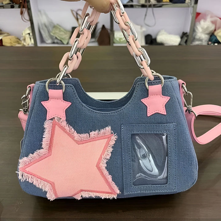 Sac à main en jean bleu avec chaînes roses, étoiles et poche transparente., 46262992928992,46262992961760