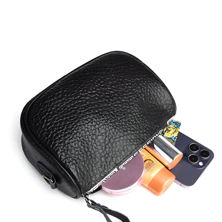 Sacoche noire en cuir texturé avec téléphone, maquillage et tube de crème à l'intérieur., 46264208425184,46264208457952,46264208490720,46264208523488