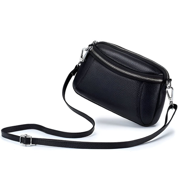 Petit sac bandoulière noir en cuir grainé avec deux compartiments zippés argentés., 46266442121440,46266442154208,46266442186976,46266442219744,46266442252512