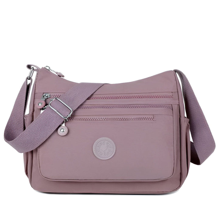 Sac bandoulière en tissu mauve avec plusieurs poches zippées., 46262993518816,46262993551584,46262993584352,46262993617120,46262993649888,46262993682656,46262993715424,46262993748192,46262993780960,46262993813728,46262993846496,46262993879264,46262993912032,46262993944800,46262993977568,46262994010336,46262994043104,46262994075872,46262994108640,46262994141408,46262994174176,46262994206944,46262994239712,46262994272480
