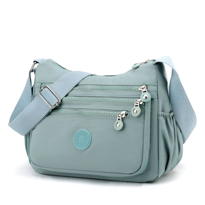 Sac bandoulière bleu clair avec multiples poches zippées et bandoulière réglable., 46262993518816,46262993551584,46262993584352,46262993617120,46262993649888,46262993682656,46262993715424,46262993748192,46262993780960,46262993813728,46262993846496,46262993879264,46262993912032,46262993944800,46262993977568,46262994010336,46262994043104,46262994075872,46262994108640,46262994141408,46262994174176,46262994206944,46262994239712,46262994272480