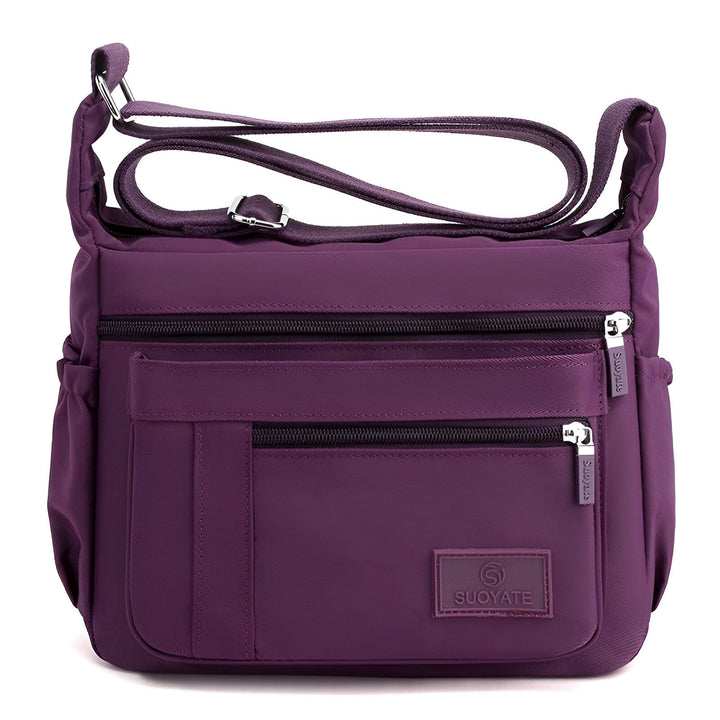 Sac bandoulière violet SUOYATE en nylon avec poches zippées., 46262993518816,46262993551584,46262993584352,46262993617120,46262993649888,46262993682656,46262993715424,46262993748192,46262993780960,46262993813728,46262993846496,46262993879264,46262993912032,46262993944800,46262993977568,46262994010336,46262994043104,46262994075872,46262994108640,46262994141408,46262994174176,46262994206944,46262994239712,46262994272480