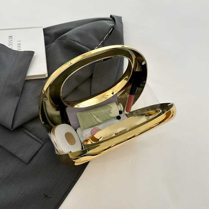 Pochette ovale dorée ouverte contenant téléphone et maquillage., 46194015502560,46194015535328,46194015568096,46194015600864,46194015633632,46194015666400