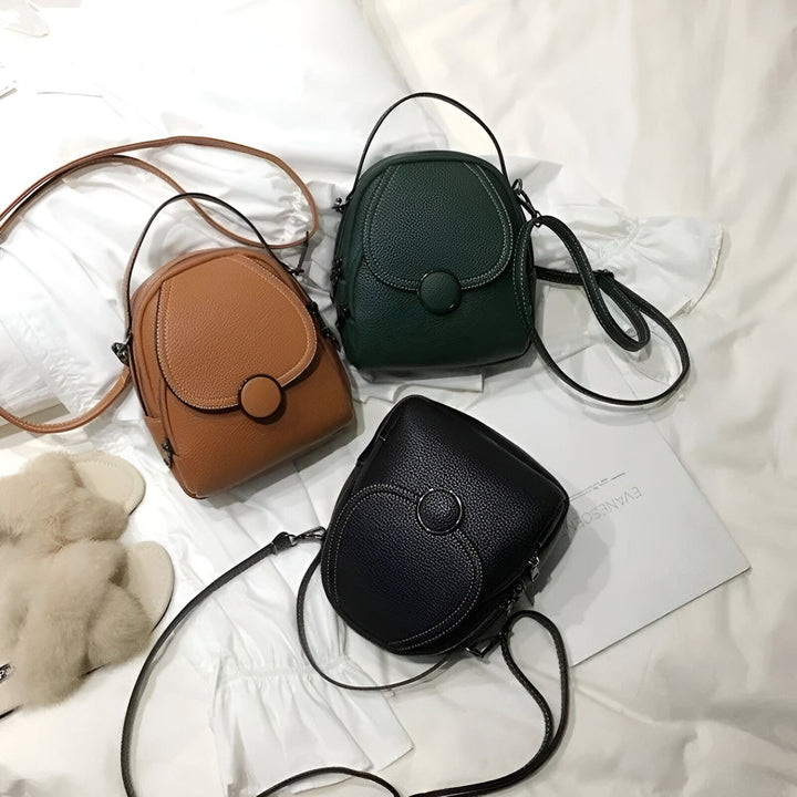 Trois petits sacs à bandoulière en cuir : camel, vert foncé et noir., 46194000822496,46194000855264,46194000888032