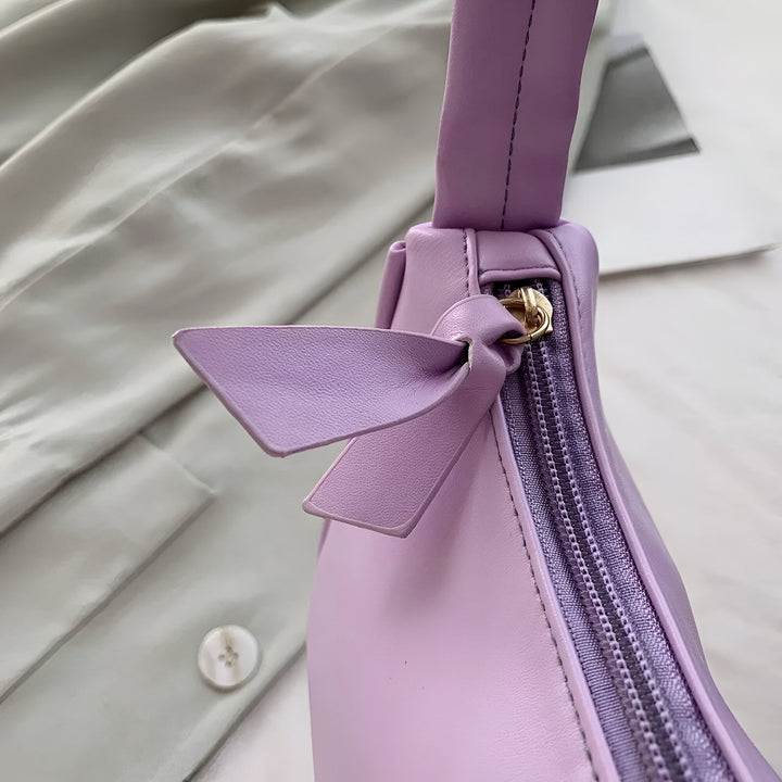 Sac à main en cuir violet lavande avec nœud et zip., 46193965596896,46193965629664,46193965662432,46193965695200,46193965727968,46193965760736,46193965793504