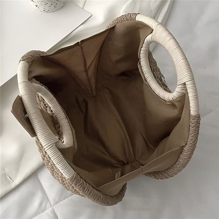 Sac en paille tressée vide vu du dessus, avec doublure marron et anses blanches., 46193945706720,46193945739488,46193945772256,46193945805024,46193945837792