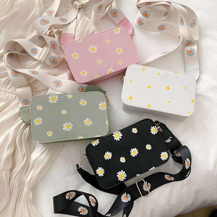 Quatre petits sacs bandoulière (rose, blanc, vert, noir) avec motif marguerites et sangle assortie., 46193876795616,46193876828384,46193876861152,46193876893920