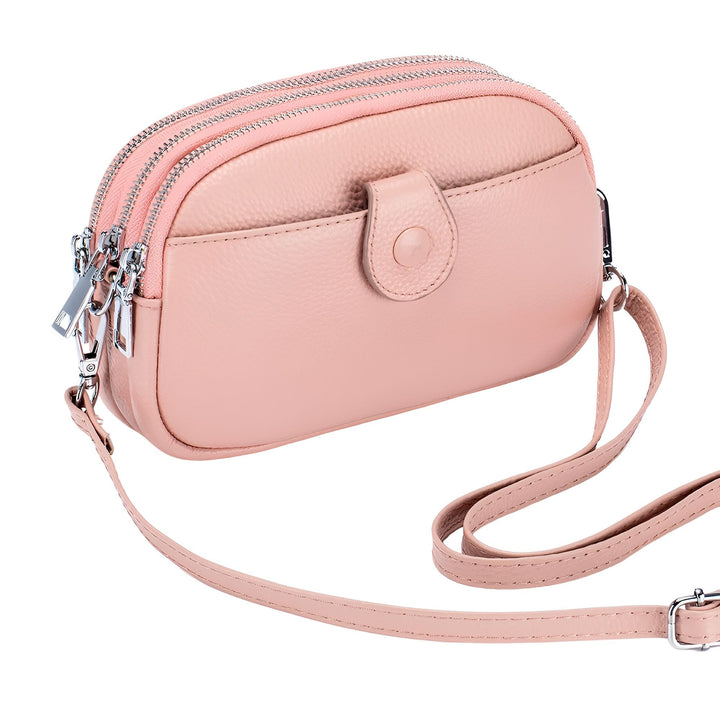 Sac bandoulière rose pâle avec multiples compartiments zippés et poche avant., 46194062459104,46194062491872,46194062524640,46194062557408,46194062590176