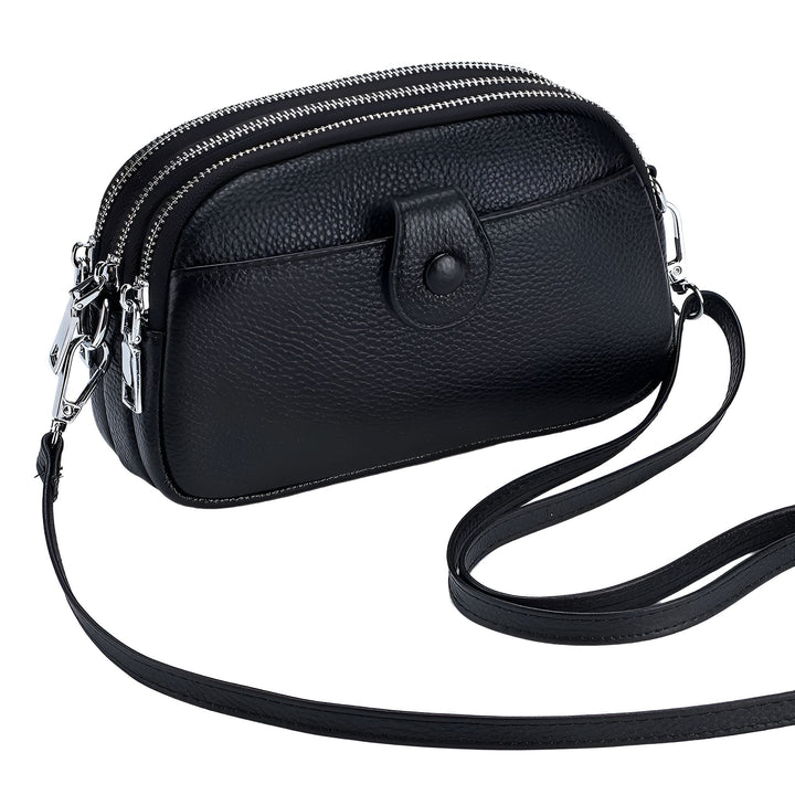 Sac à main noir en cuir grainé avec bandoulière, 3 poches zippées et petite poche avant., 46194062459104,46194062491872,46194062524640,46194062557408,46194062590176
