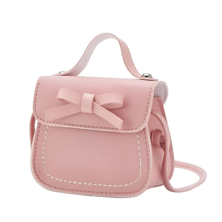Petit sac à main rose pour enfant avec un nœud décoratif et des coutures blanches., 46193988698336,46193988731104,46193988796640,46193988829408,46193988862176,46193988894944,46193988927712