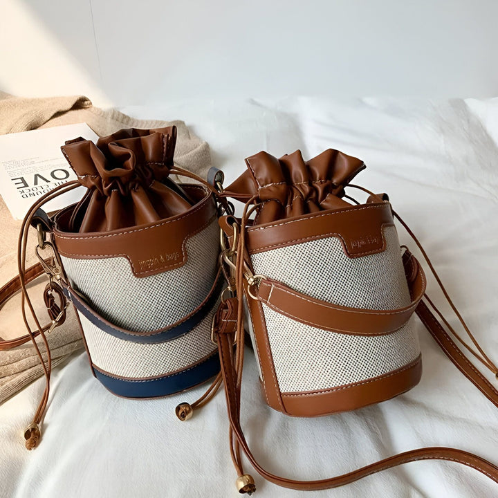 Deux sacs seau à cordon en toile et cuir marron, un avec bande bleue., 46194011308256,46194011373792