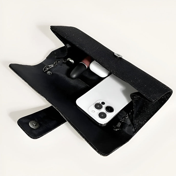 Pochette noire pailletée avec téléphone, écouteurs et rouge à lèvres à l'intérieur., 46194019074272