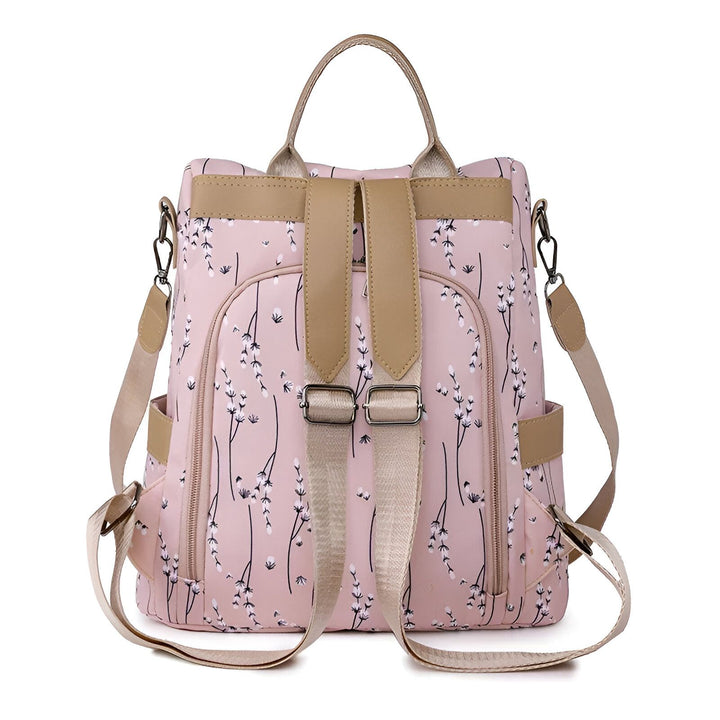 Sac à dos rose en tissu à motif floral blanc, bretelles et poignée beiges., 46193997971680,46193998004448,46193998037216,46193998069984