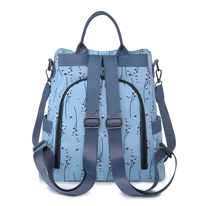 Sac à dos bleu à motif de fleurs blanches avec bretelles et bandoulière., 46193997971680,46193998004448,46193998037216,46193998069984