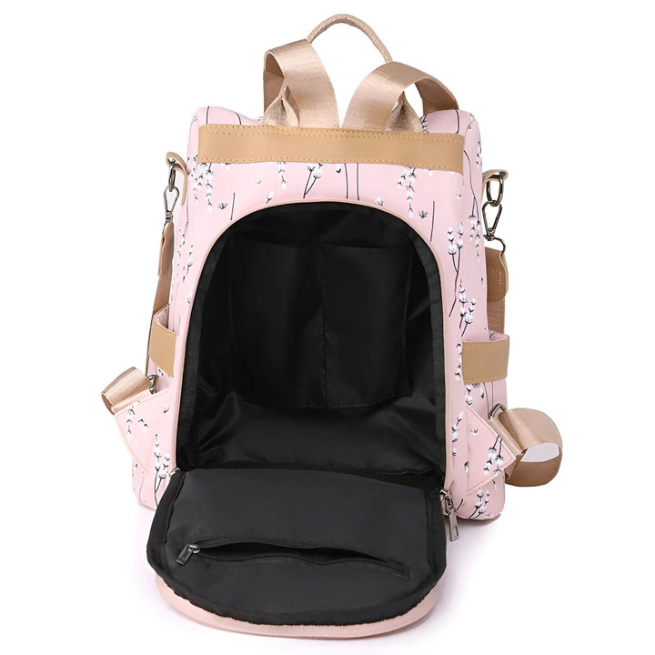 Sac à dos rose ouvert avec motif floral blanc, bretelles beiges et intérieur noir., 46193997971680,46193998004448,46193998037216,46193998069984