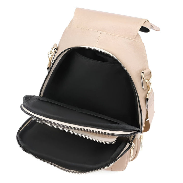 Sac à dos beige ouvert montrant l'intérieur avec compartiments et fermetures éclair., 46193999642848,46193999675616,46193999708384