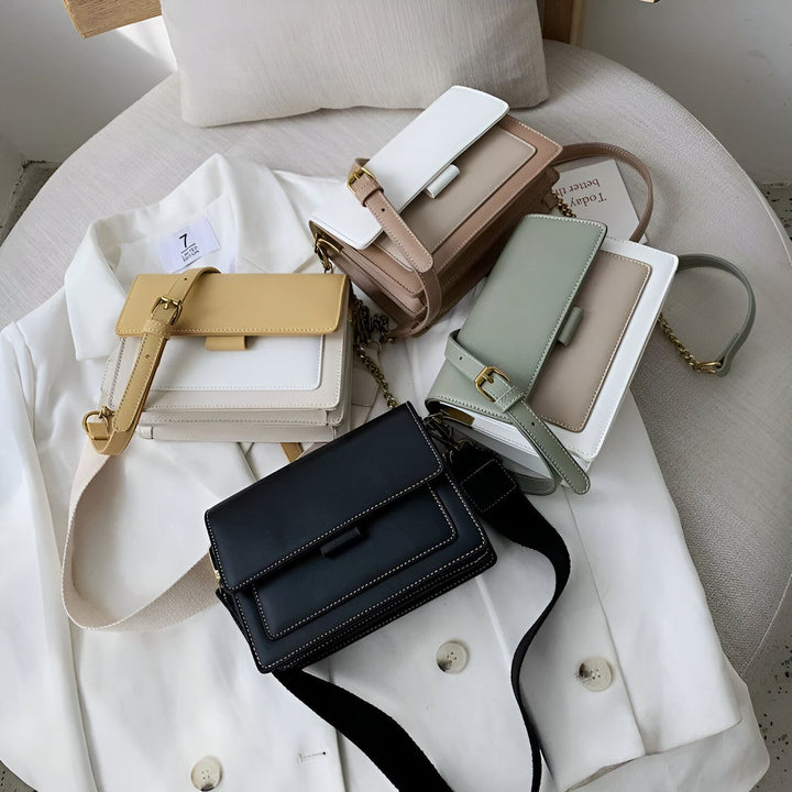 Quatre sacs à main femme de différentes couleurs sur un blazer blanc., 46193877221600,46193877254368,46193877287136,46193877319904