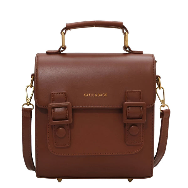 Sac à main marron KAXIU & BAGS type sacoche avec poignée, bandoulière et boucles décoratives., 46194003312864,46194003345632,46194003378400,46194003411168