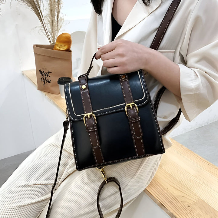 Petit sac noir style cartable avec bretelles marron et boucles dorées, 46193899569376,46193899602144,46193899634912