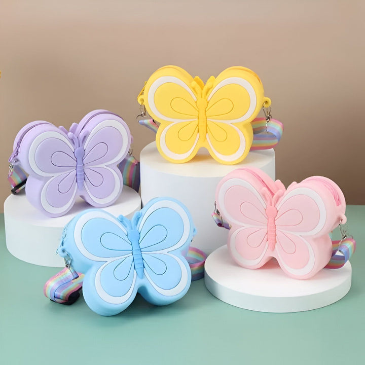 Quatre sacs en forme de papillon de couleurs violet, jaune, bleu et rose avec sangle arc-en-ciel., 46193987289312,46193987322080,46193987354848,46193987387616