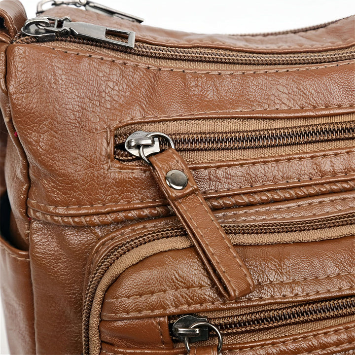 Sac en cuir marron avec fermetures éclair et détails texturés, 46194026643680,46194026676448,46194026709216,46194026741984,46194026774752,46194026807520