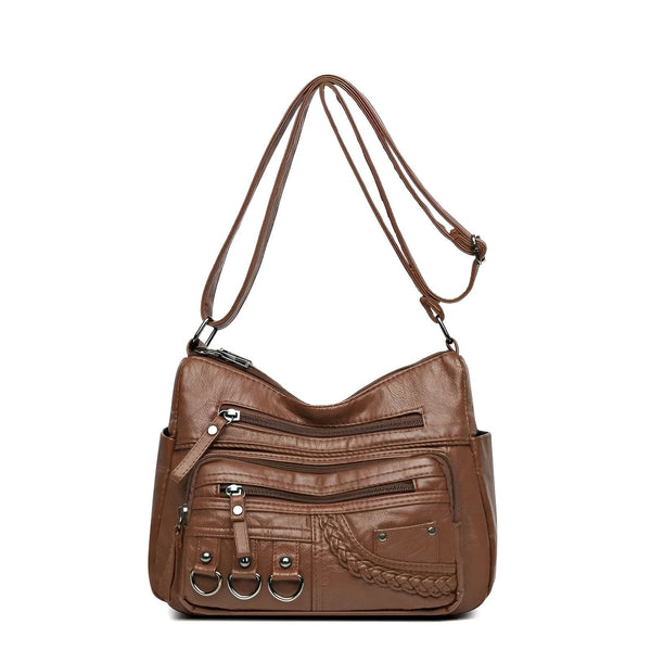 Sac bandoulière marron avec plusieurs poches zippées et détails anneaux et tressage., 46194026643680,46194026676448,46194026709216,46194026741984,46194026774752,46194026807520