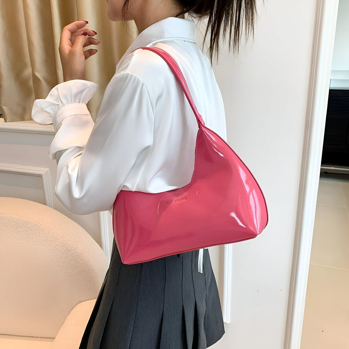 Femme portant un sac à épaule rose brillant CULT GAIA avec une chemise blanche et une jupe noire plissée., 46193869619424,46193869652192,46193869684960,46193869717728,46193869750496