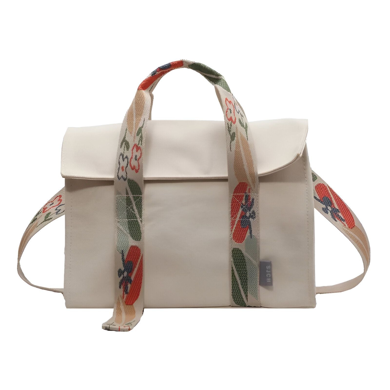 Sac à main en toile beige avec des poignées et une bandoulière imprimées de fleurs rouges, vertes et bleues.