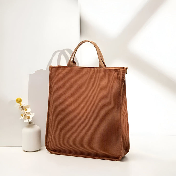 Sac cabas marron en velours côtelé avec poignées et fermeture éclair sur fond blanc., 46193957503200,46193957535968,46193957568736,46193957601504
