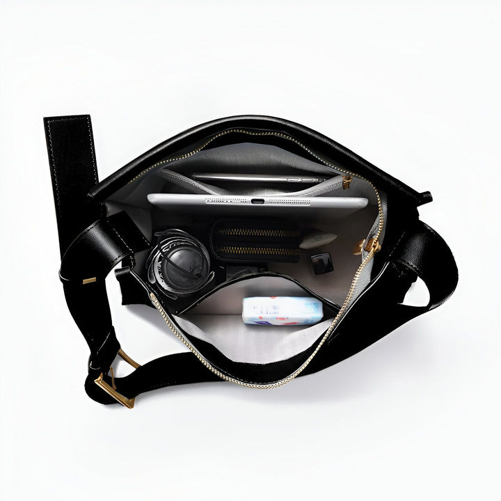 Sac noir ouvert avec tablette, téléphone, portefeuille, parapluie et mouchoirs., 46193866965216