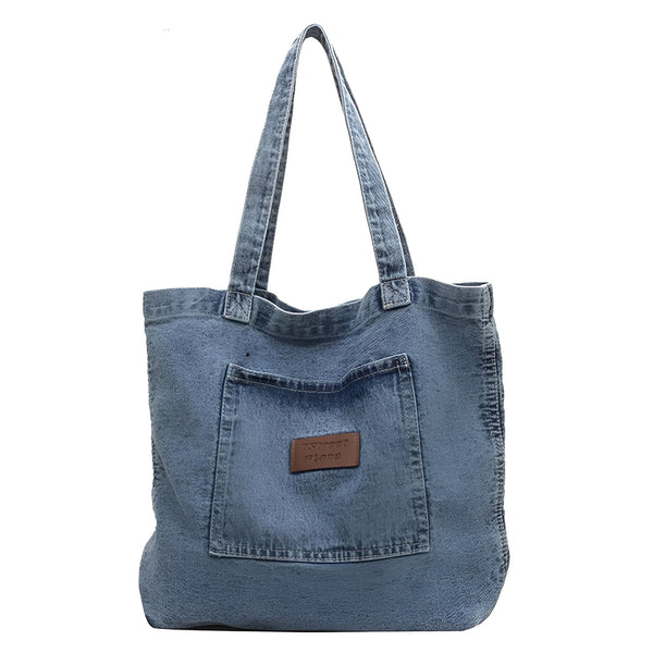 Sac tote bag en jean bleu avec poche avant et étiquette., 46193991942368,46193991975136