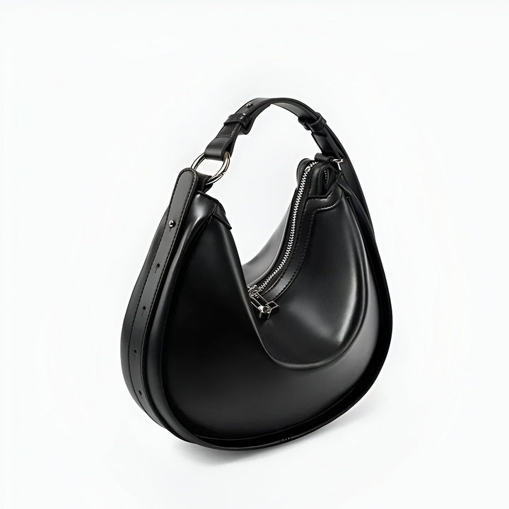 Sac à main noir en cuir forme croissant avec bandoulière et zip argenté, 46193867751648