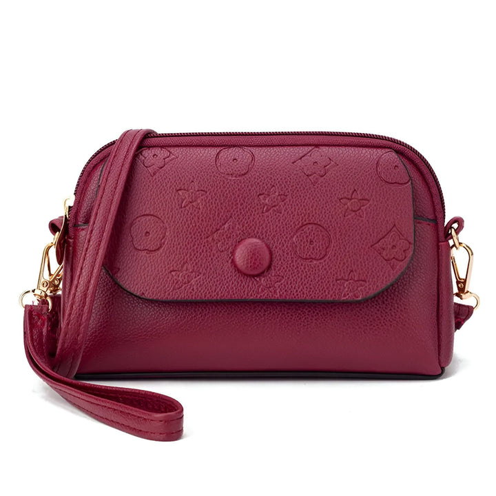 Sac bandoulière en cuir bordeaux avec motifs floraux et dragonne, 46262992503008,46262992535776,46262992568544,46262992601312,46262992634080,46262992666848,46262992699616